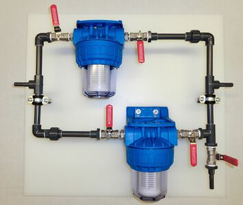 Double filter system for the pump suction side